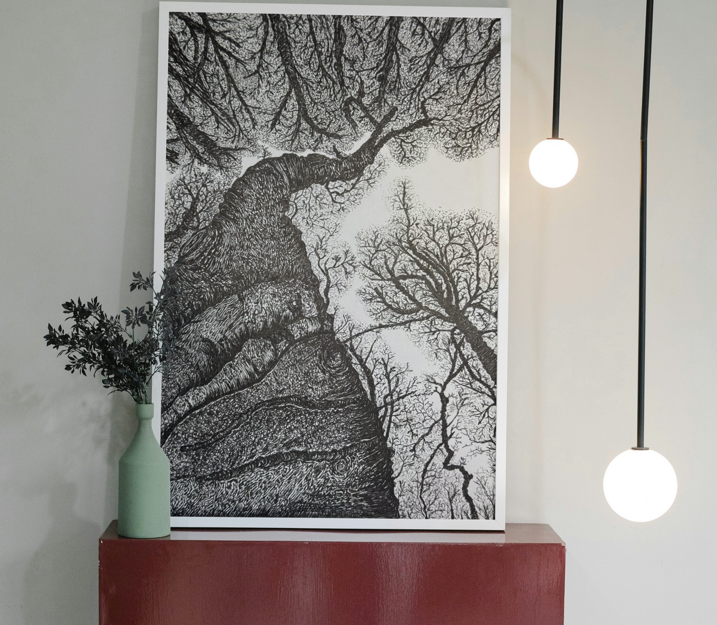 Black ink forest drawing showing twisted tree limbs and upward view
