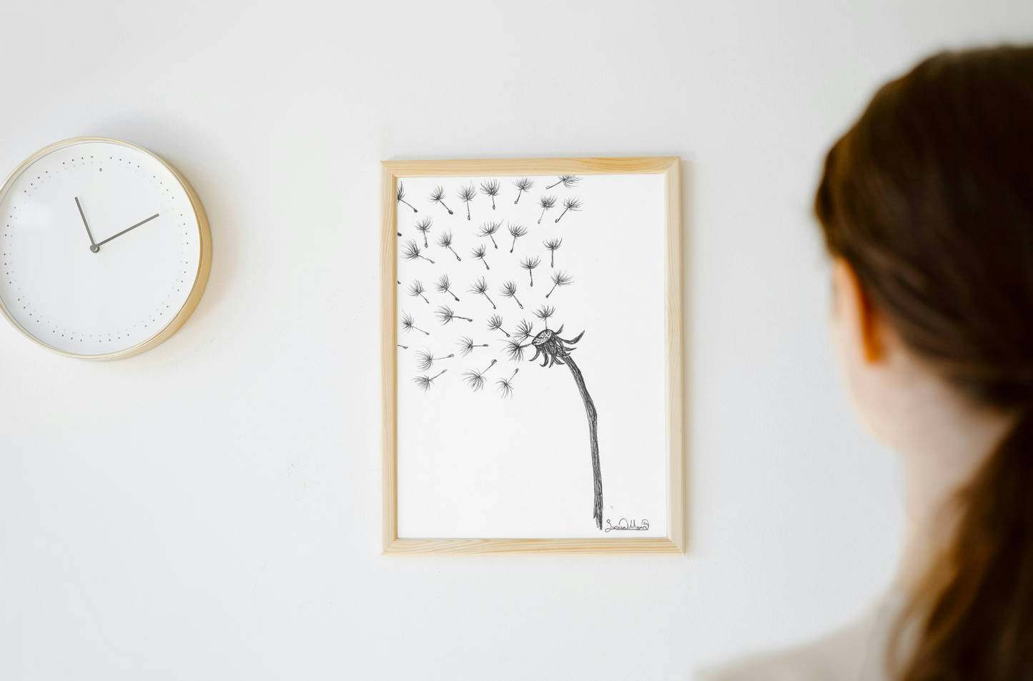 Wishes Art Print A4 Frame next to clock