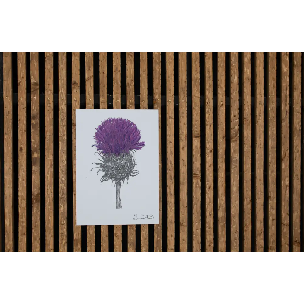 Purple Thistle Art Print hanging on wall.