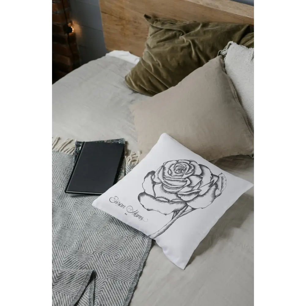 White Rose Cushion on bed